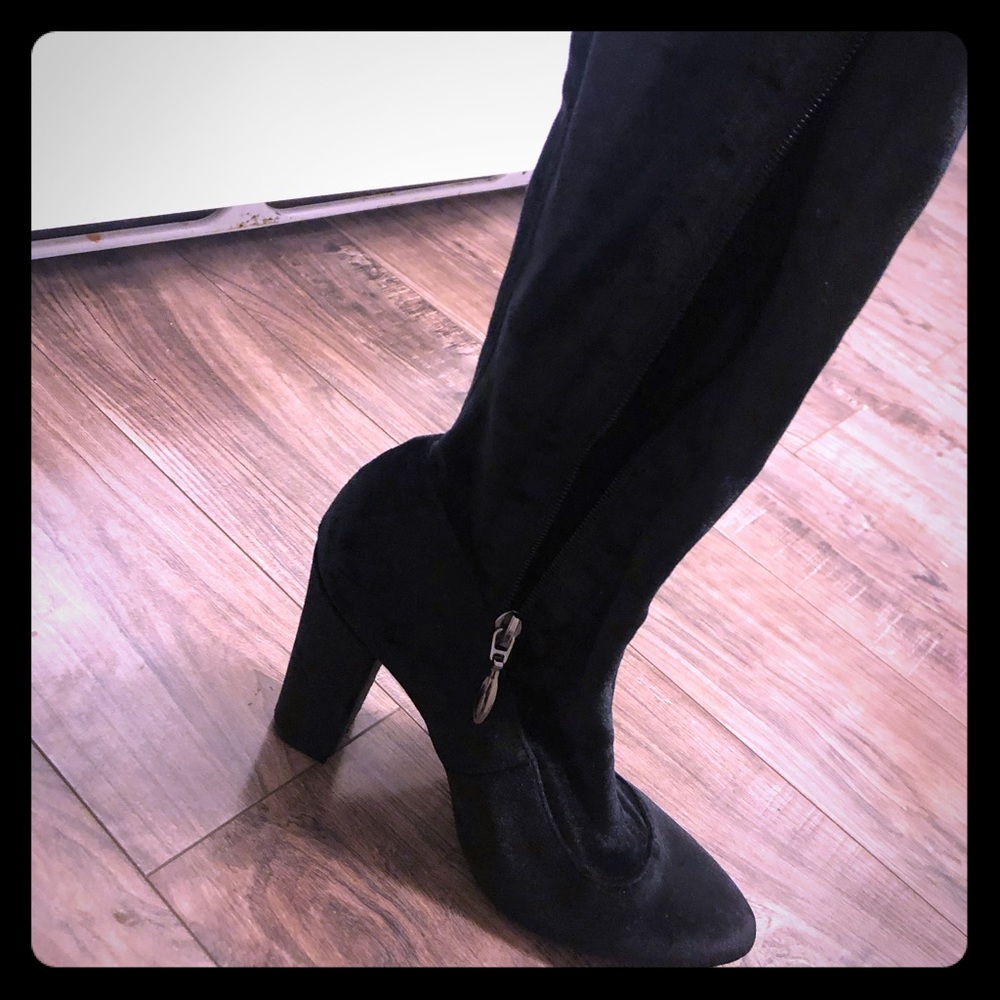 Worn once over the knee heel boots.